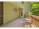 Back deck featuring a wooden floor and railing, and access to the backyard through an exterior door at 3124 Briar Stream Run, Raleigh, NC 27612