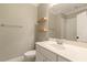 Neutral bathroom featuring floating wood shelves, and a combination shower and tub at 3124 Briar Stream Run, Raleigh, NC 27612