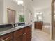 Bright bathroom with dual sink vanity, granite counters, soaking tub and walk-in shower at 3124 Briar Stream Run, Raleigh, NC 27612