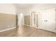 Bedroom featuring a chair rail, hardwood floors and an open door at 3124 Briar Stream Run, Raleigh, NC 27612