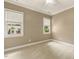 Bedroom with carpet, ceiling fan, crown molding and dual windows at 3124 Briar Stream Run, Raleigh, NC 27612