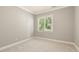 Cozy bedroom with plush carpeting, neutral paint and natural light at 3124 Briar Stream Run, Raleigh, NC 27612