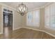 Dining room with plantation shutters, hardwood floors, and natural light at 3124 Briar Stream Run, Raleigh, NC 27612