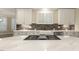 Stylish kitchen featuring white cabinets, quartz countertops, and stainless steel appliances at 3124 Briar Stream Run, Raleigh, NC 27612