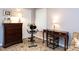 Bedroom with desk, dresser, stationary bike, and upholstered chaise lounge at 3600 Star Trek Ct, Raleigh, NC 27604