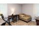 Bedroom featuring a stationary bike, upholstered chaise lounge, and neutral carpet at 3600 Star Trek Ct, Raleigh, NC 27604