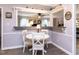 Dining room features white table set with hardwood floors at 3600 Star Trek Ct, Raleigh, NC 27604