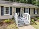 Inviting front porch with white railing and black door; stylish exterior at 3600 Star Trek Ct, Raleigh, NC 27604