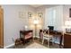 Cozy office space featuring a dark wood desk, warm lighting, and calming decor at 3600 Star Trek Ct, Raleigh, NC 27604