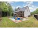 Inviting backyard features a swimming pool, screened porch, and ample seating for outdoor enjoyment at 40 Yellowstone Ct, Youngsville, NC 27596