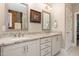 Bathroom featuring double vanity, granite countertops, framed mirrors, and plenty of storage space at 40 Yellowstone Ct, Youngsville, NC 27596