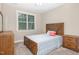 Inviting bedroom with soft carpet, natural light, and a cozy, comfortable atmosphere at 40 Yellowstone Ct, Youngsville, NC 27596