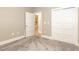 Bright bedroom featuring soft carpet, bi-fold closet door, and entry to other rooms at 40 Yellowstone Ct, Youngsville, NC 27596