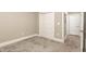 Bright bedroom featuring soft carpet, bi-fold closet door, and entry to the other rooms at 40 Yellowstone Ct, Youngsville, NC 27596