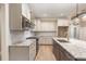 Modern kitchen features white cabinets, granite countertops, stainless appliances, and a center island with a sink at 40 Yellowstone Ct, Youngsville, NC 27596