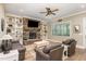 Cozy living room featuring a stone fireplace, built-in shelving, and comfortable seating at 40 Yellowstone Ct, Youngsville, NC 27596