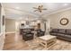 Open-concept living room flows into a modern kitchen, complete with a breakfast bar at 40 Yellowstone Ct, Youngsville, NC 27596