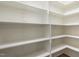 Walk-in pantry with custom shelving to keep your groceries and cooking supplies organized at 40 Yellowstone Ct, Youngsville, NC 27596