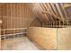 Unfinished attic space with exposed wooden beams, ample storage, and potential for expansion at 40 Yellowstone Ct, Youngsville, NC 27596