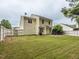 Spacious backyard with a well-maintained lawn, a charming brick patio, and a privacy fence at 4020 Mindspring Dr, Raleigh, NC 27610