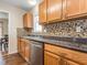 Kitchen featuring stainless steel appliances, wood cabinets, and a tiled backsplash at 4020 Mindspring Dr, Raleigh, NC 27610