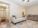 Bright and comfortable living room showcasing wood floors, neutral colors, and natural light at 4020 Mindspring Dr, Raleigh, NC 27610