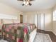 The main bedroom features neutral colors, a ceiling fan, and hardwood floors at 4020 Mindspring Dr, Raleigh, NC 27610