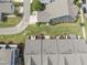 Aerial view of a community of townhomes with well-maintained lawns and mature trees at 409 Rhamkatte Rd, Holly Springs, NC 27540