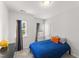 Bright bedroom featuring neutral walls, gray carpet, and modern furnishings at 409 Rhamkatte Rd, Holly Springs, NC 27540