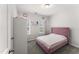 Cozy bedroom with large windows, carpet floors, and a closet at 409 Rhamkatte Rd, Holly Springs, NC 27540