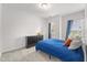 Bright bedroom featuring neutral walls, gray carpet, and modern furnishings at 409 Rhamkatte Rd, Holly Springs, NC 27540