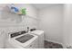 Well-equipped laundry room with modern washer and dryer at 409 Rhamkatte Rd, Holly Springs, NC 27540