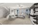 Spacious living room features a comfortable sectional sofa, ceiling fan, and plenty of natural light at 409 Rhamkatte Rd, Holly Springs, NC 27540