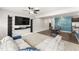 Open-concept view of the living room and dining area with hardwood floors and modern decor at 409 Rhamkatte Rd, Holly Springs, NC 27540