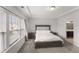 Large main bedroom with ample natural light and a trey ceiling at 409 Rhamkatte Rd, Holly Springs, NC 27540