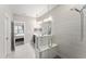 Walk-in shower with floor-to-ceiling tile and built-in seat at 409 Rhamkatte Rd, Holly Springs, NC 27540