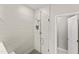 Modern walk-in shower featuring beautiful tile work and a glass door at 409 Rhamkatte Rd, Holly Springs, NC 27540