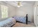 Bedroom with two beds, ceiling fan, carpet and window at 4108 Lazyriver Ln, Durham, NC 27712