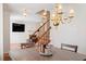 Cozy dining room featuring a wooden table, decorative chandelier, and staircase to the upper level at 4108 Lazyriver Ln, Durham, NC 27712