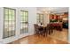 Open concept dining area adjacent to kitchen, bathed in natural light from large doors and windows at 4108 Lazyriver Ln, Durham, NC 27712