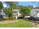 Beautiful home featuring a well-maintained lawn, mature trees, a driveway with parking, and classic curb appeal at 4108 Lazyriver Ln, Durham, NC 27712