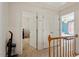 Open hallway leads to a bedroom and closet with a carpeted floor at 4108 Lazyriver Ln, Durham, NC 27712