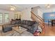 Spacious living room with stairs, an adjacent dining room, and comfortable seating provides ample space for gatherings at 4108 Lazyriver Ln, Durham, NC 27712