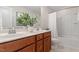 Bathroom featuring double vanity and shower with bathtub at 4120 Overcup Oak Ln, Cary, NC 27519