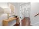 Welcoming entryway with hardwood floors, console table with lamp, and views into other rooms at 4120 Overcup Oak Ln, Cary, NC 27519