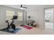 Exercise room features a stationary bike, yoga mat, and shelving at 4120 Overcup Oak Ln, Cary, NC 27519