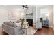 Inviting living room with modern furnishings, a fireplace, neutral decor, and hardwood floors at 4120 Overcup Oak Ln, Cary, NC 27519