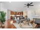 Bright living space showcasing hardwood floors, an open floor plan, and a modern kitchen at 4120 Overcup Oak Ln, Cary, NC 27519