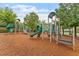 Well-maintained playground with slides, climbing structures, and a soft, wood chip surface at 4120 Overcup Oak Ln, Cary, NC 27519
