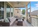 Cozy screened porch featuring comfortable seating, a stylish rug, and a view of the outdoor surroundings for relaxation at 4120 Overcup Oak Ln, Cary, NC 27519